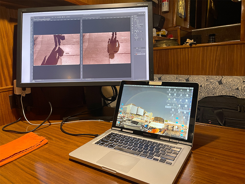 Computer Workspace, Big Monitor, Photoshop with Two Images on Screen.